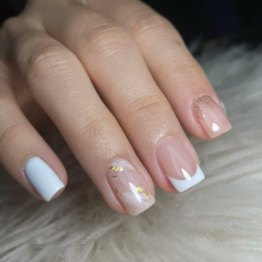 White French nails with gold detail at Rullier Beauty & Spa