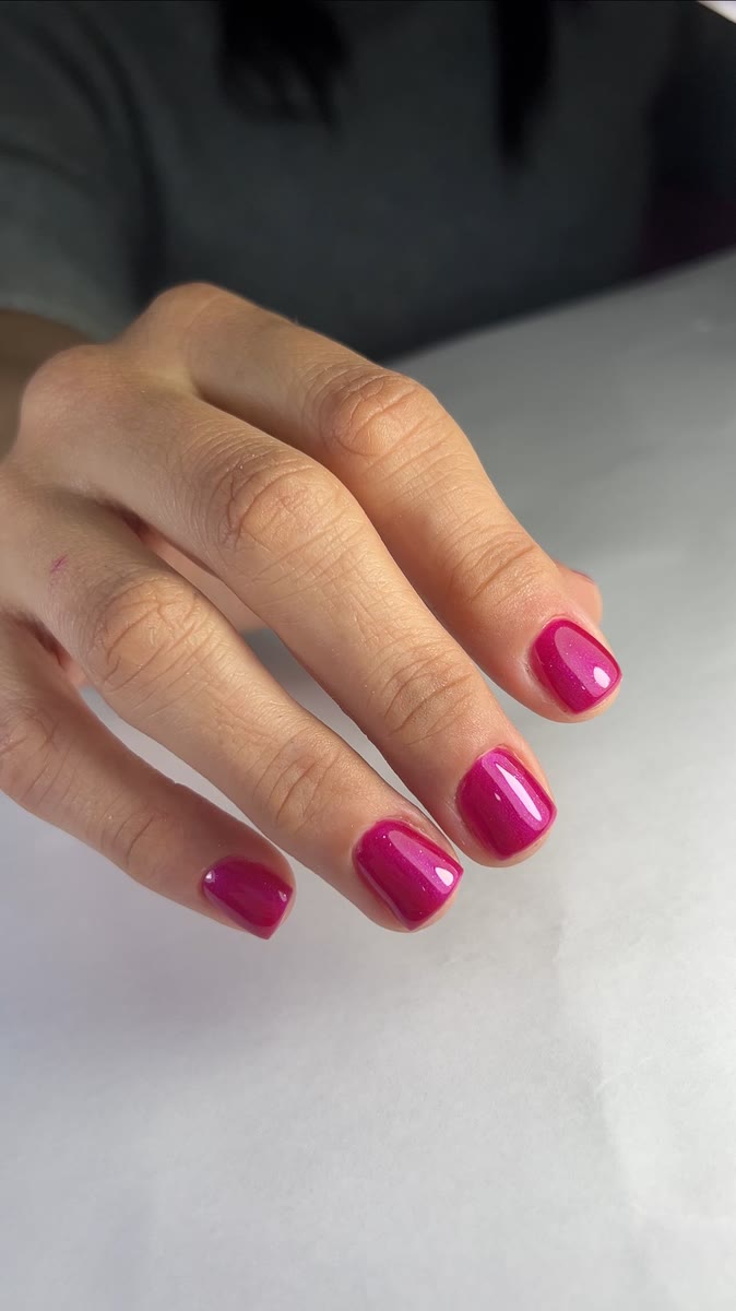 Magenta gel nails after a rubber base application at Rullier Beauty & Spa