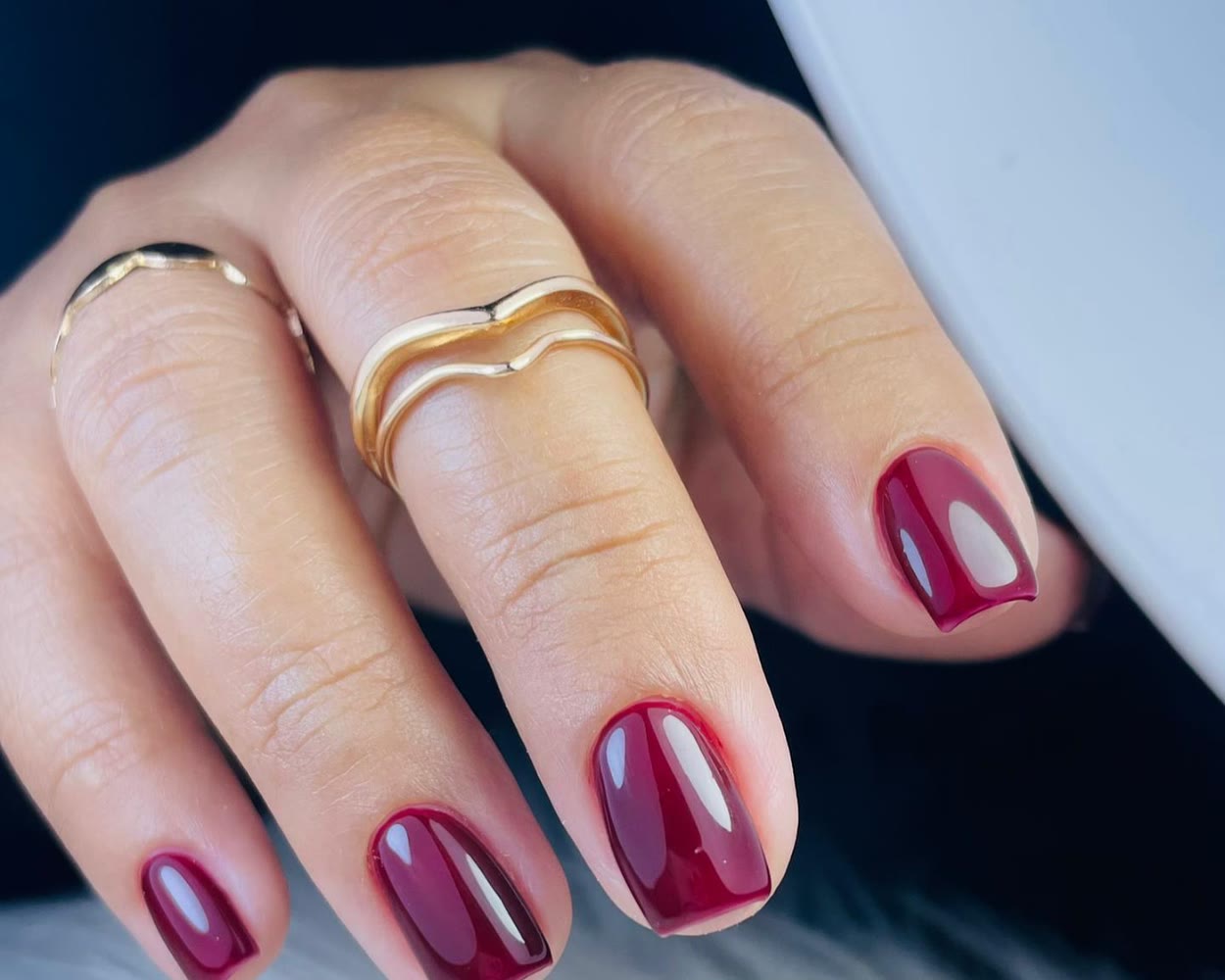 Deep wine gel nails with gold rings
